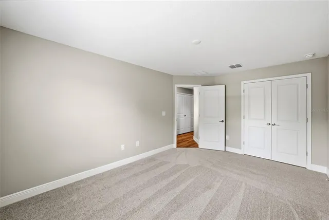 a bathroom with a sink toilet a mirror and vanity