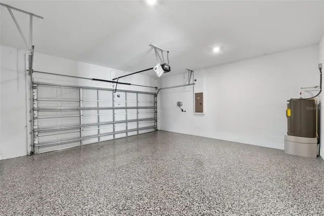 a view of a house with backyard and a garden