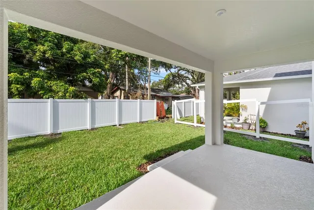 a view of a backyard with plants and garden