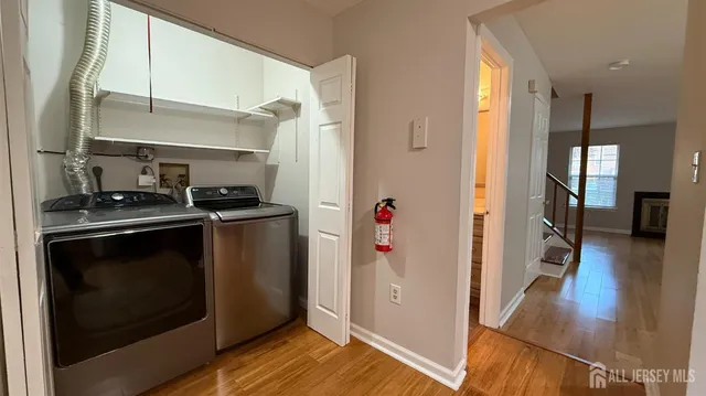a kitchen with a refrigerator and a stove