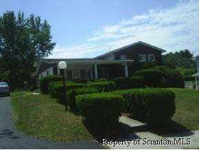 828 Spring Street Moosic, PA 18507 - Photo 1 of 1 a front view of a house with a yard