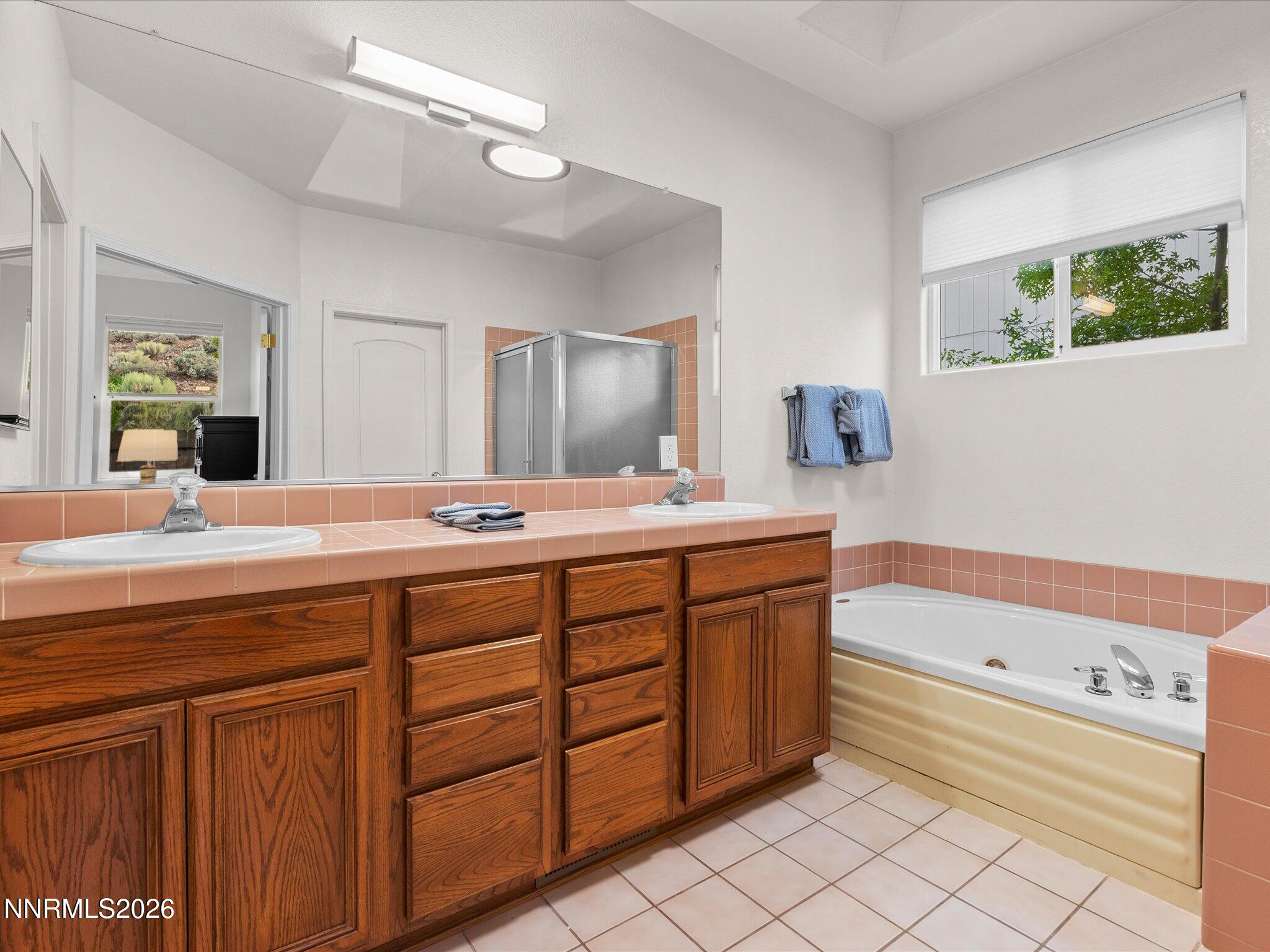 3101 Green River Drive Reno, NV 89503 - Photo 30 of 62 a bathroom with a sink double vanity and a mirror