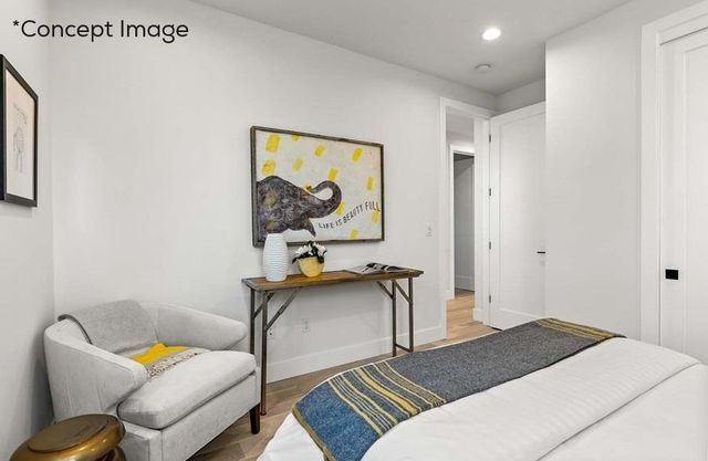 a bedroom with furniture and a window