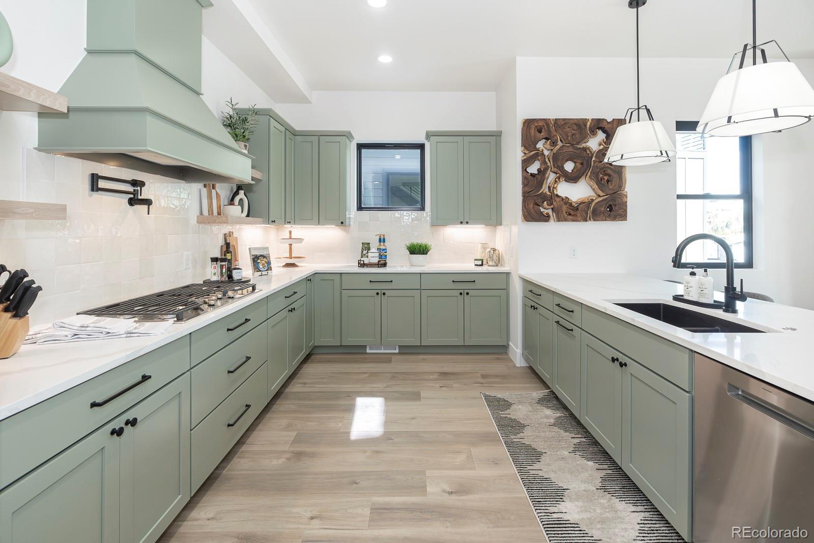 175 Whistlestop Circle Winter Park, CO 80482 - Photo 16 of 36 a large kitchen with stainless steel appliances granite countertop a sink stove and refrigerator