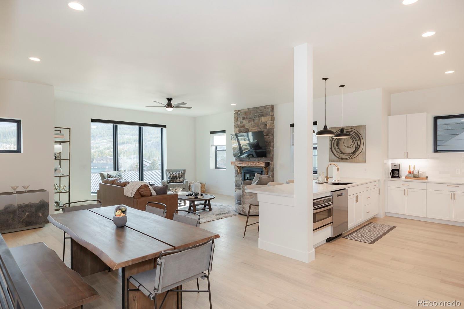 175 Whistlestop Circle Winter Park, CO 80482 - Photo 18 of 36 a kitchen with white cabinets and stainless steel appliances