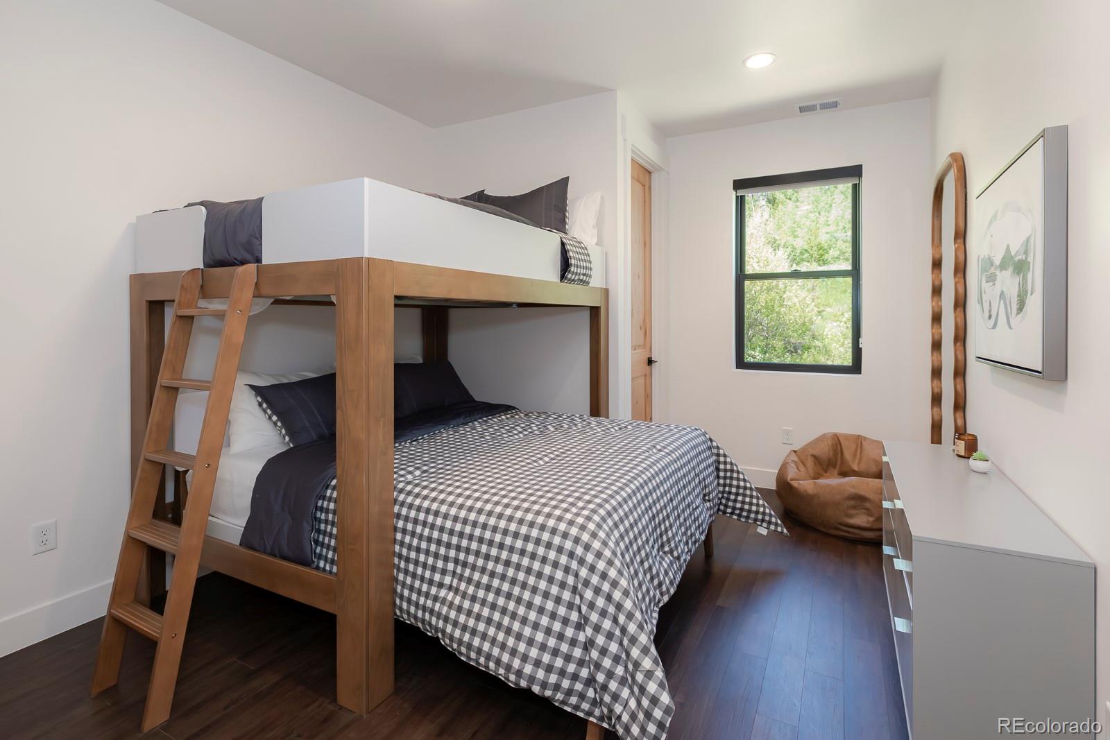 175 Whistlestop Circle Winter Park, CO 80482 - Photo 32 of 36 a bedroom with a bed and window