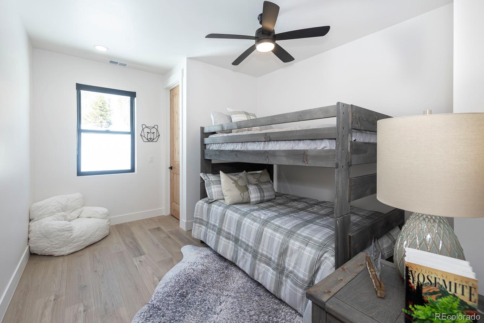 175 Whistlestop Circle Winter Park, CO 80482 - Photo 33 of 36 a bedroom with a bed and a window