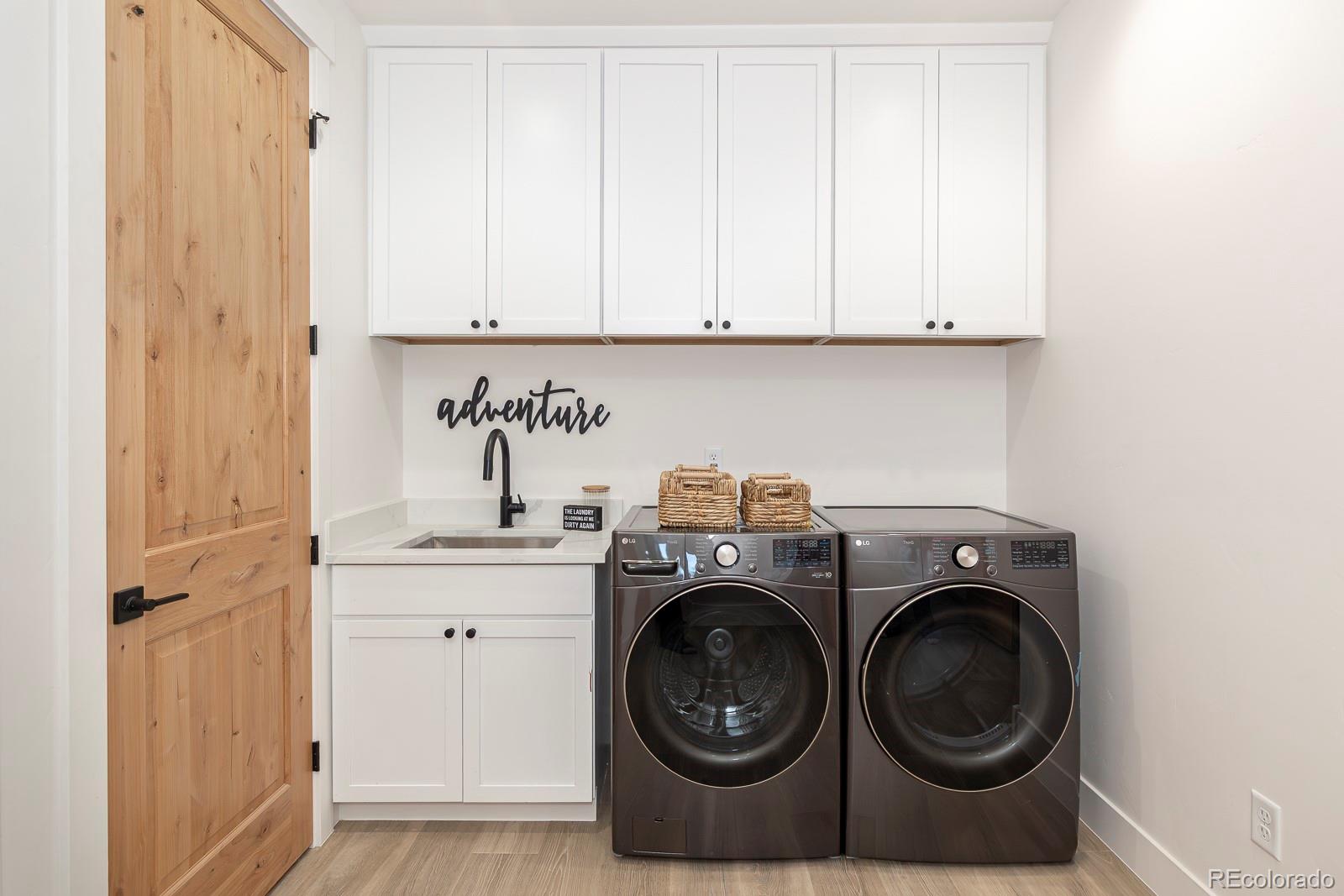 175 Whistlestop Circle Winter Park, CO 80482 - Photo 35 of 36 a utility room with sink dryer and washer