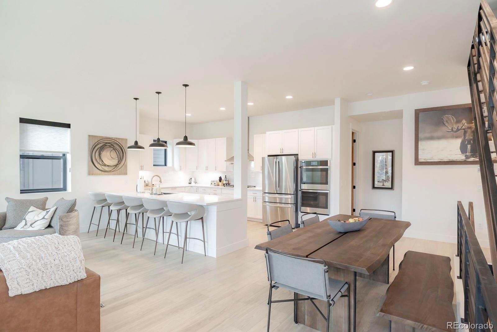 175 Whistlestop Circle Winter Park, CO 80482 - Photo 6 of 36 a large kitchen with a table and chairs