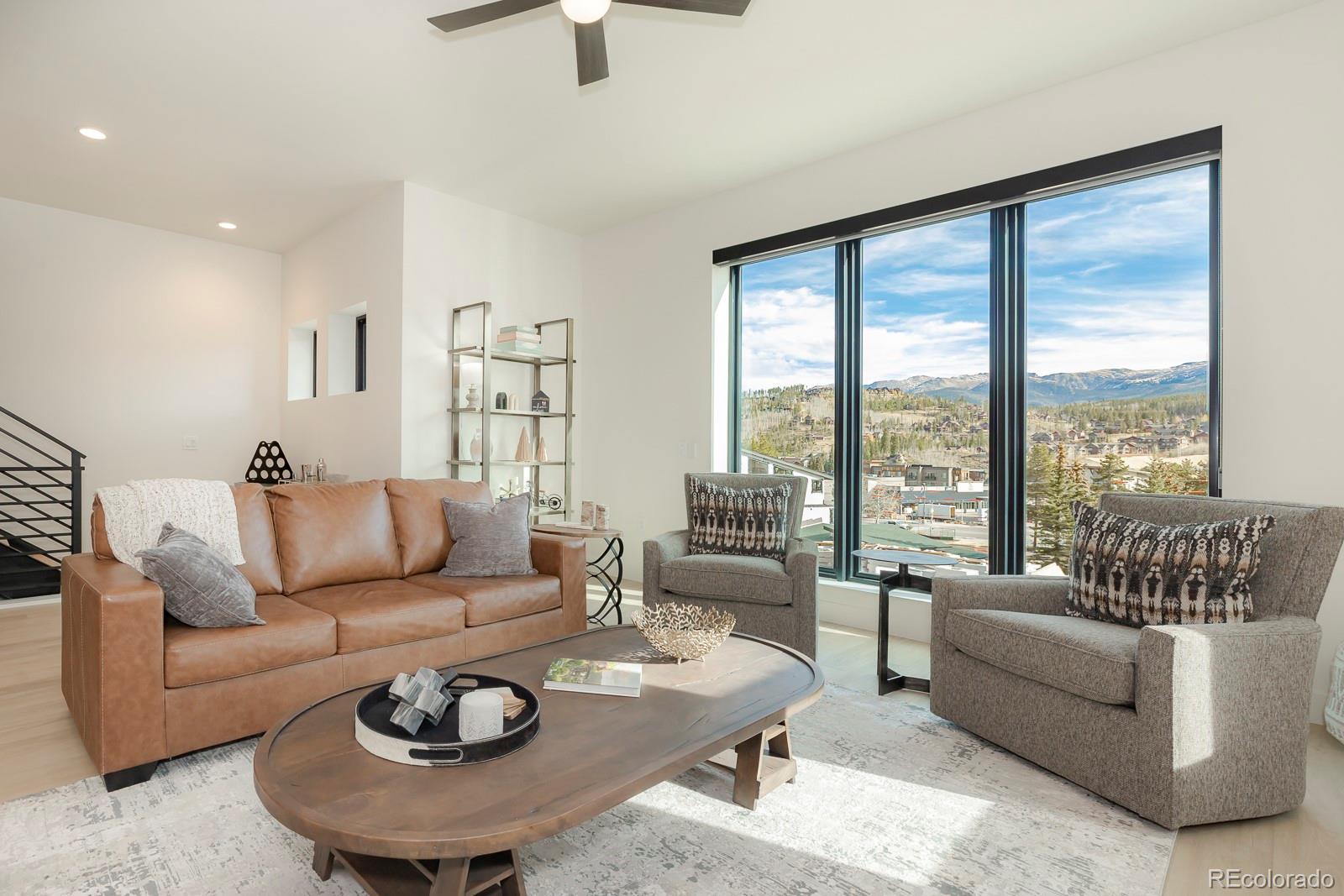 175 Whistlestop Circle Winter Park, CO 80482 - Photo 9 of 36 a living room with furniture and a large window