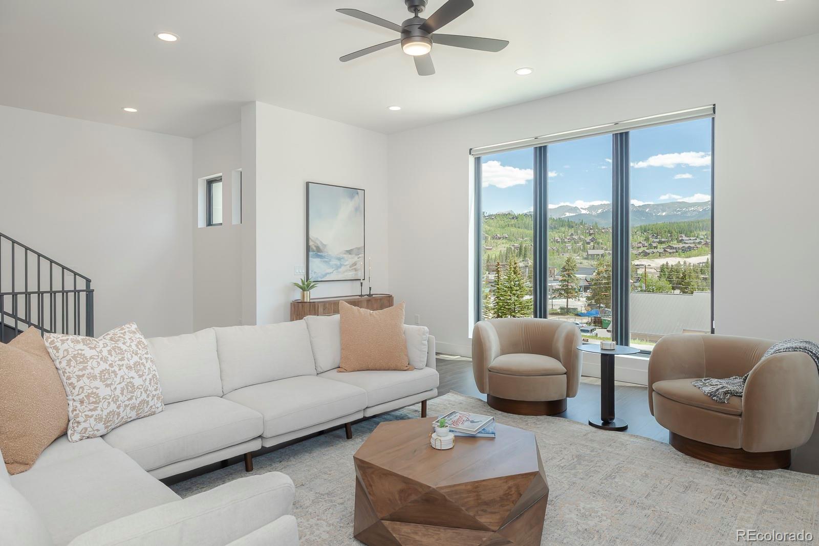 175 Whistlestop Circle Winter Park, CO 80482 - Photo 10 of 36 a living room with furniture and a large window