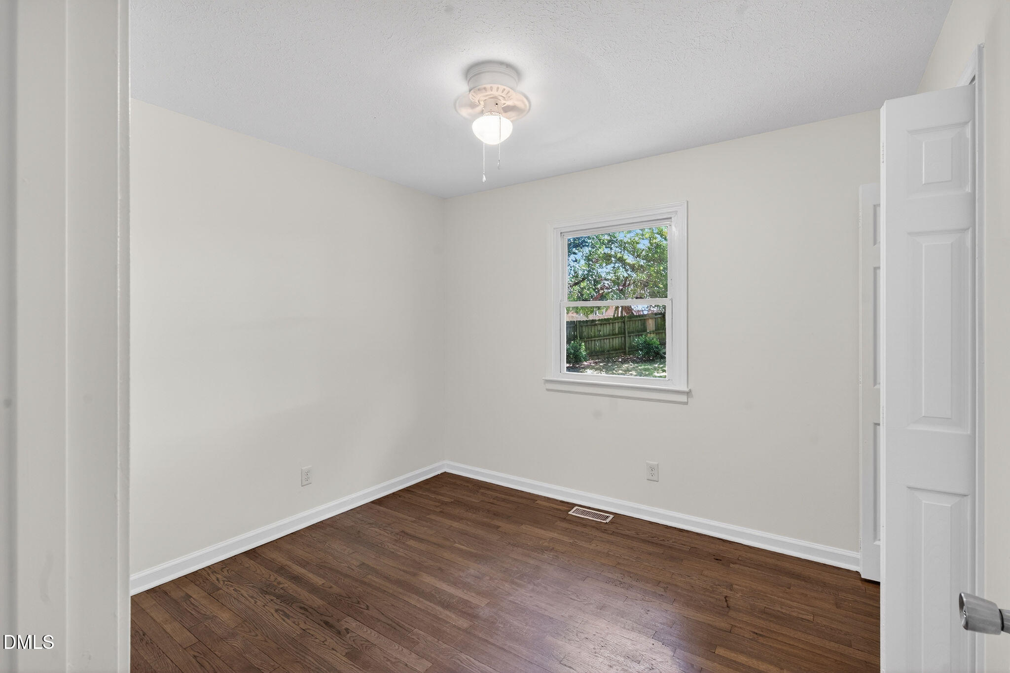 904 Seabrook Road Raleigh, NC 27610 - Photo 12 of 31 wooden floor in an empty room with a window