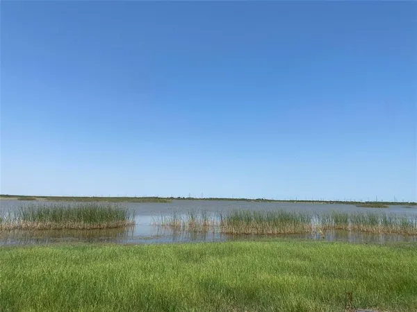 a view of a lake with a big yard
