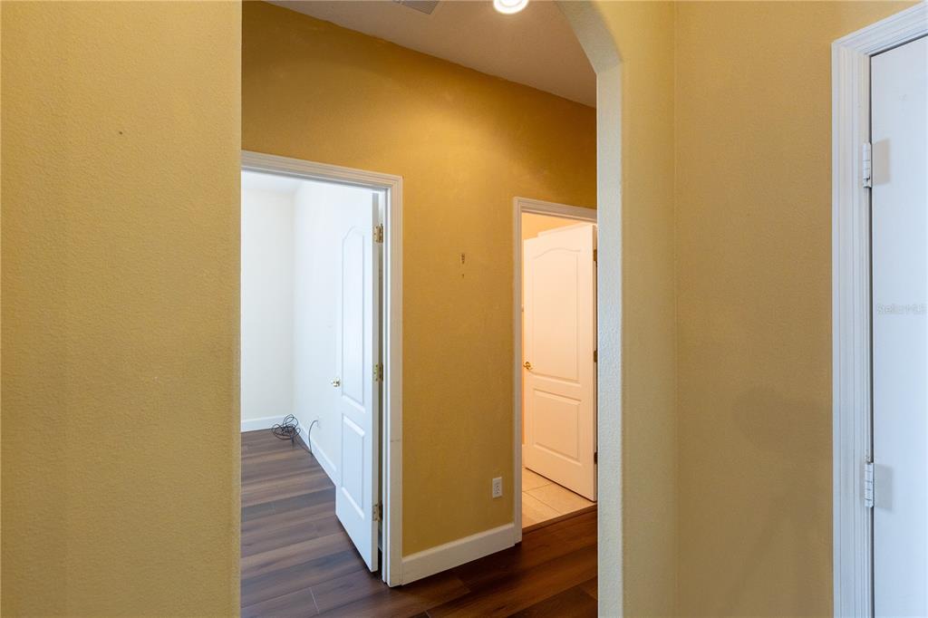 65 Calliope Street Ocoee, FL 34761 - Photo 27 of 60 a view of a hallway with wooden floor