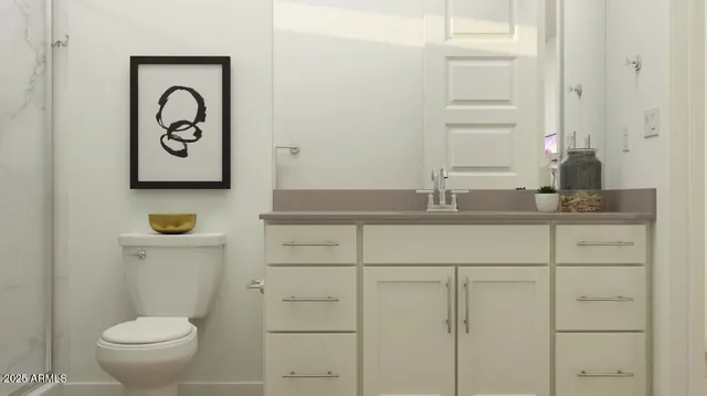 a bathroom with a toilet and a sink