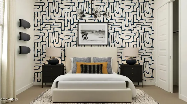 a spacious bedroom with a bed and a painting on the wall