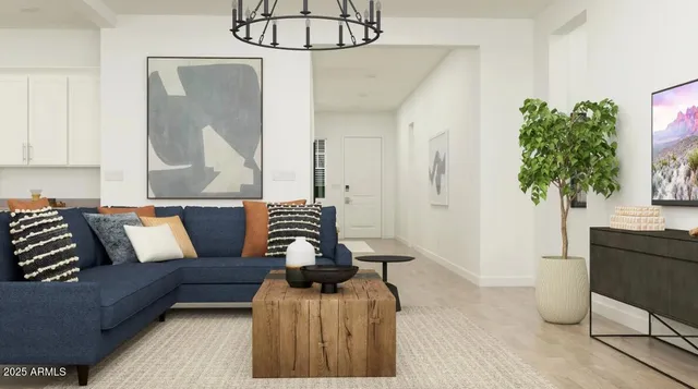 a living room with furniture and a potted plant