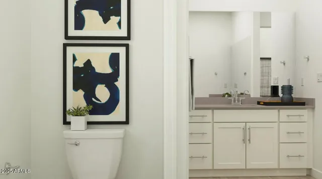 a bathroom with a sink and mirror