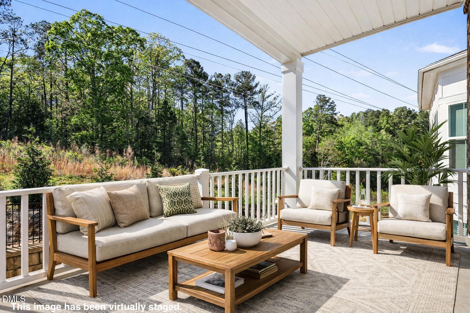 11549 Helmond Way, Unit 115 Raleigh, NC 27617 - Photo 10 of 25 a balcony with furniture and a potted plant