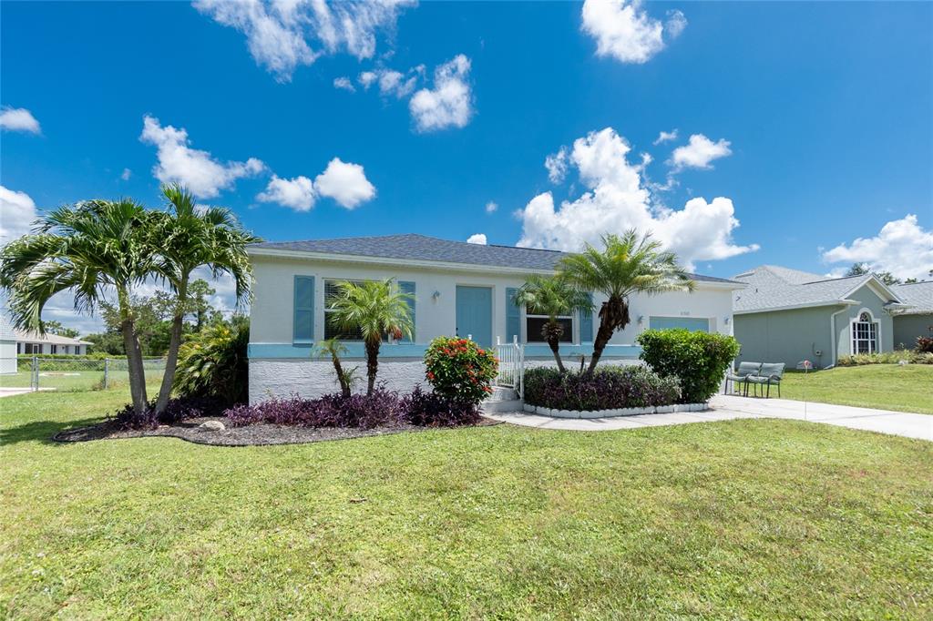 11360 Baggot Avenue Englewood, FL 34224 - Photo 2 of 31 a view of a house with a backyard porch and sitting area