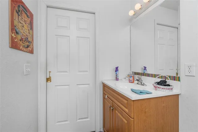 a bathroom with a sink and a mirror