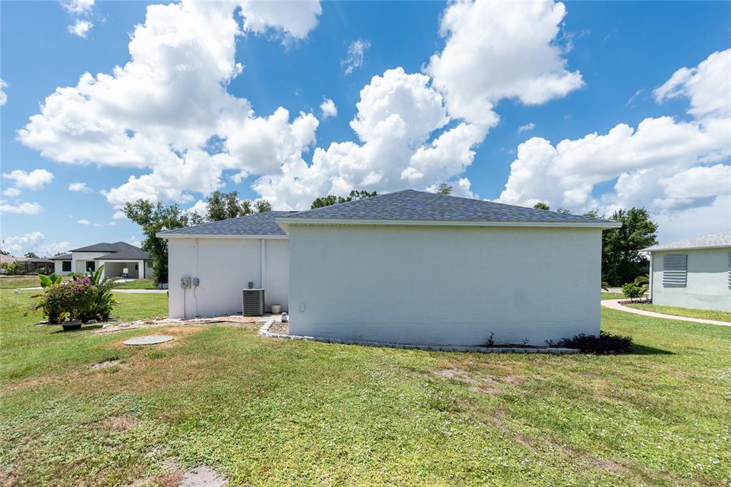 11360 Baggot Avenue Englewood, FL 34224 - Photo 28 of 31 a backyard of a house with table and chairs
