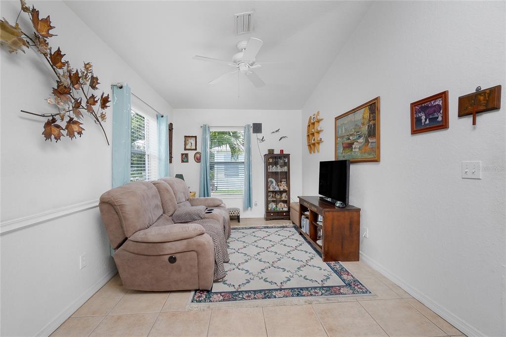 11360 Baggot Avenue Englewood, FL 34224 - Photo 6 of 31 a living room with furniture and a flat screen tv