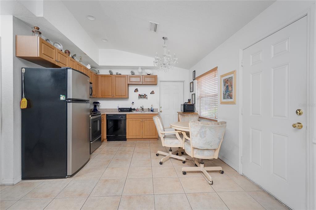 11360 Baggot Avenue Englewood, FL 34224 - Photo 8 of 31 a work place with a chair and glass door