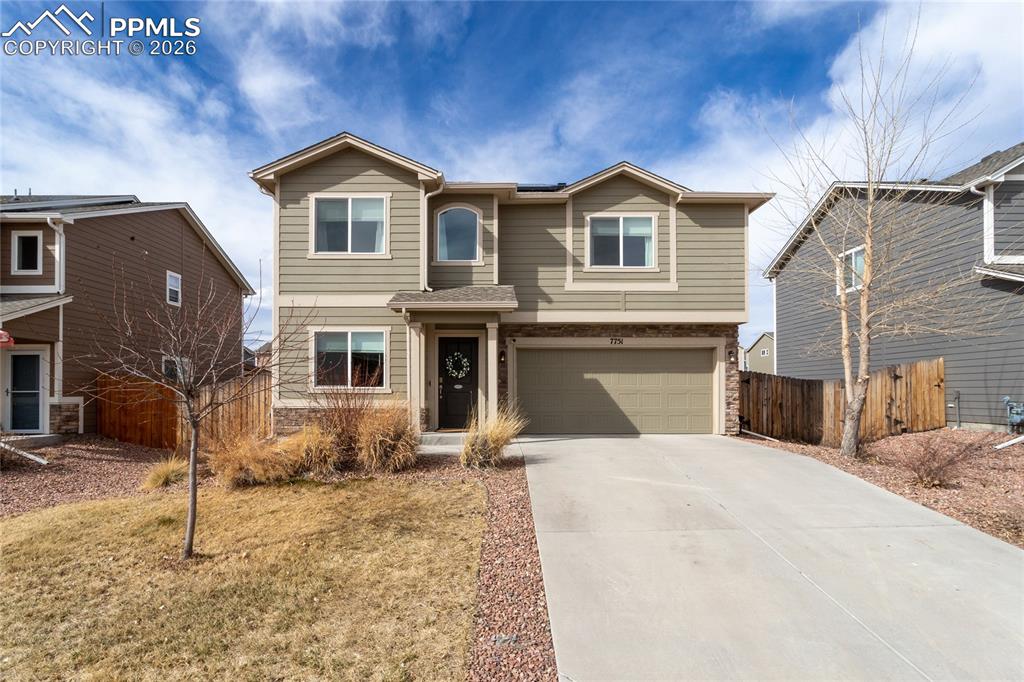 7751 Berwyn Loop Peyton, CO 80831 - Photo 1 of 50 a view of a yard in front of a house