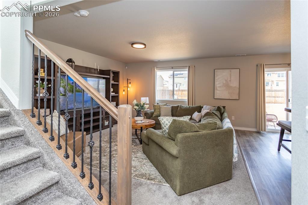 7751 Berwyn Loop Peyton, CO 80831 - Photo 11 of 50 a living room with furniture and hard wood flooring