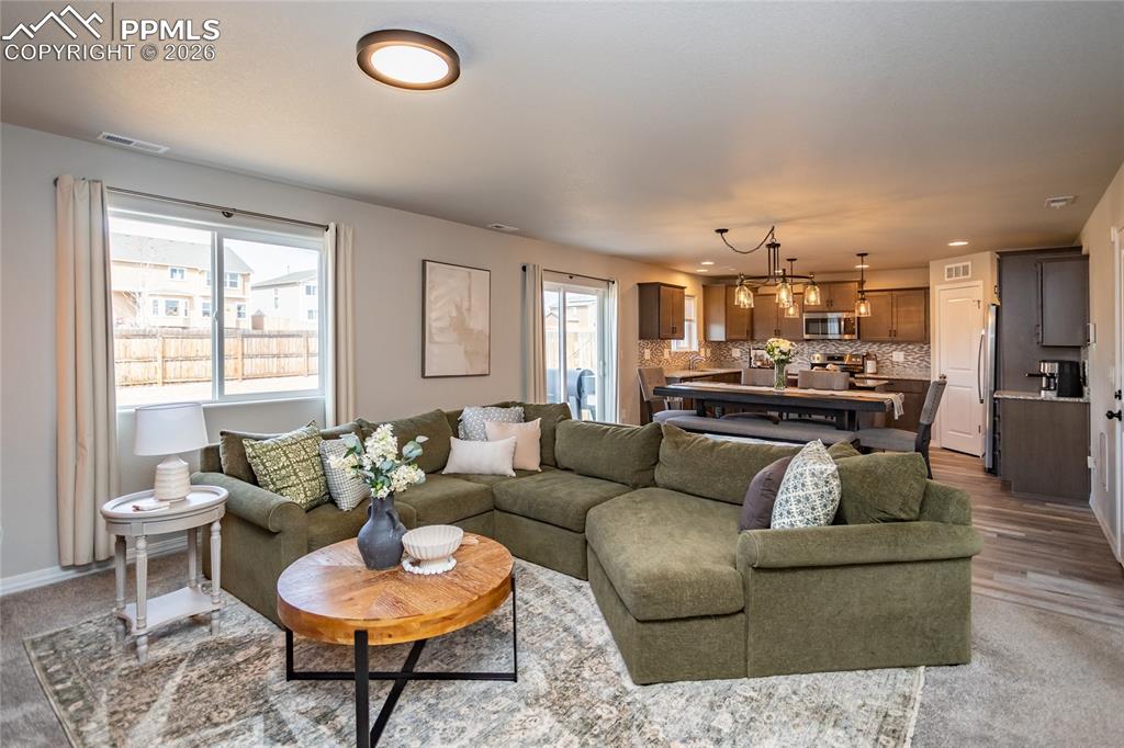 7751 Berwyn Loop Peyton, CO 80831 - Photo 14 of 50 a living room with furniture and a large window