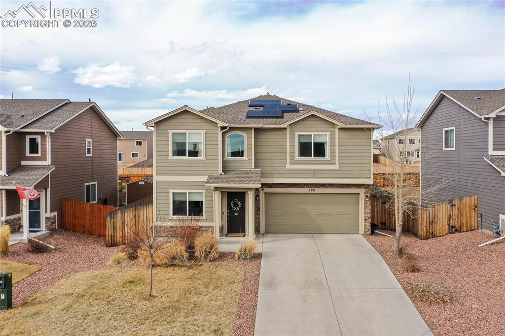 7751 Berwyn Loop Peyton, CO 80831 - Photo 2 of 50 a front view of a house with a yard and garage
