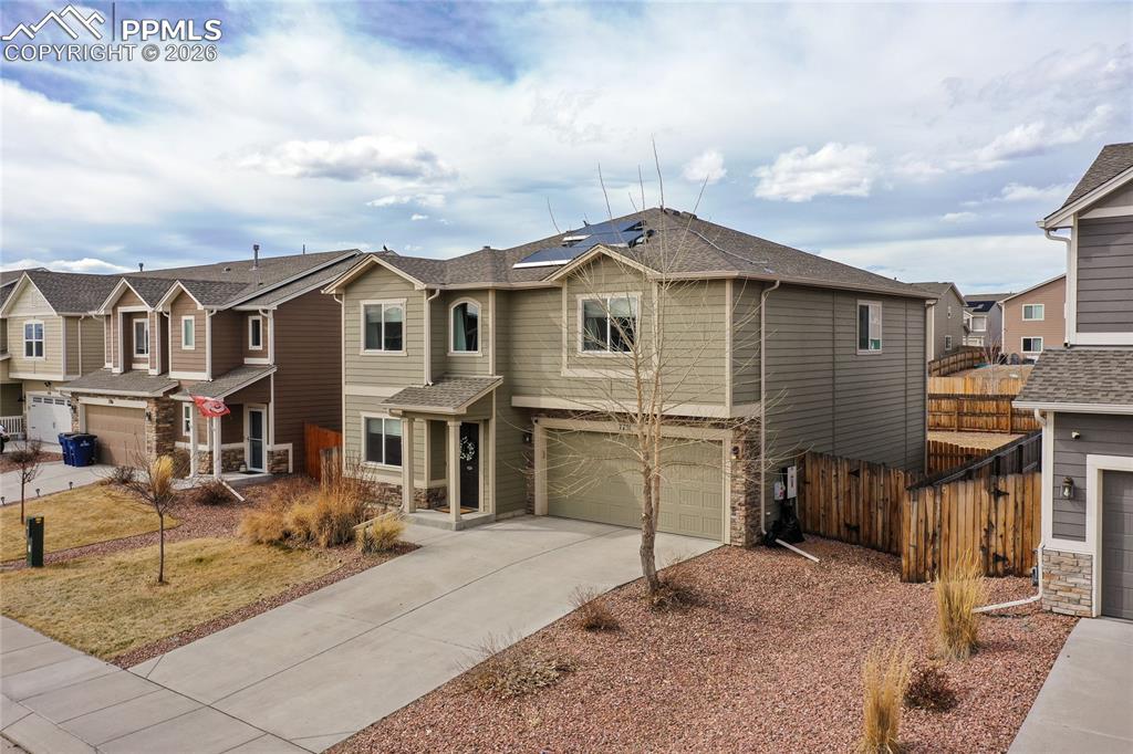 7751 Berwyn Loop Peyton, CO 80831 - Photo 3 of 50 a front view of a house with a yard