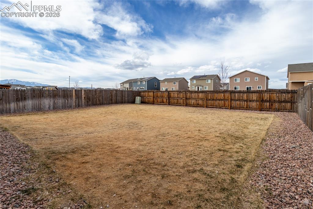 7751 Berwyn Loop Peyton, CO 80831 - Photo 45 of 50 a view of residential houses with yard and wooden fence