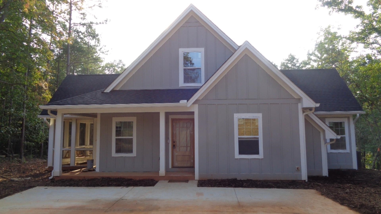 256 Seraph Pointe Road Lavonia, GA 30553 - Photo 1 of 1 a house that has a tree in front of it
