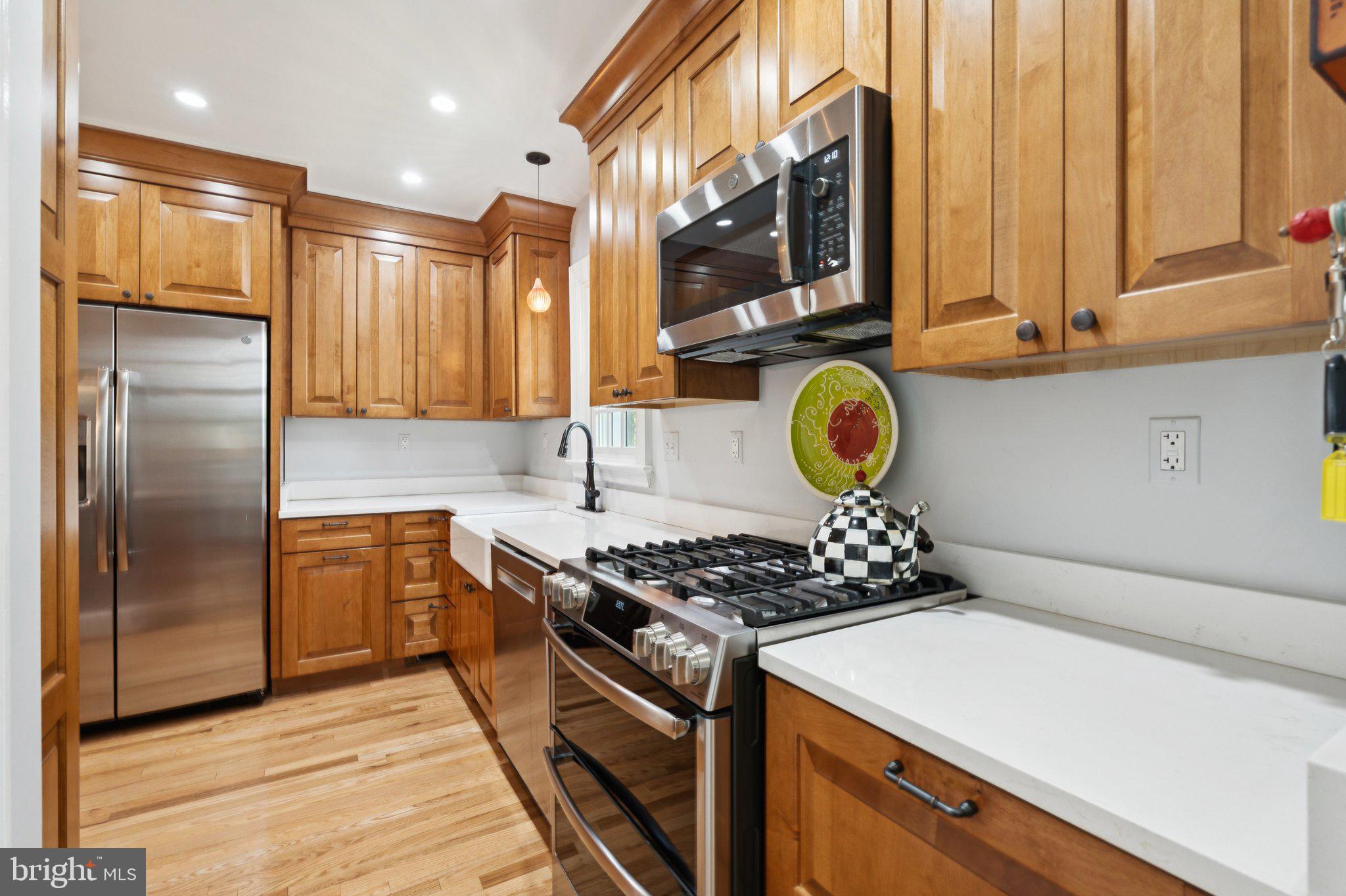 3666 Military Road Arlington, VA 22207 - Photo 19 of 69 a kitchen with stainless steel appliances granite countertop a stove a sink and a refrigerator