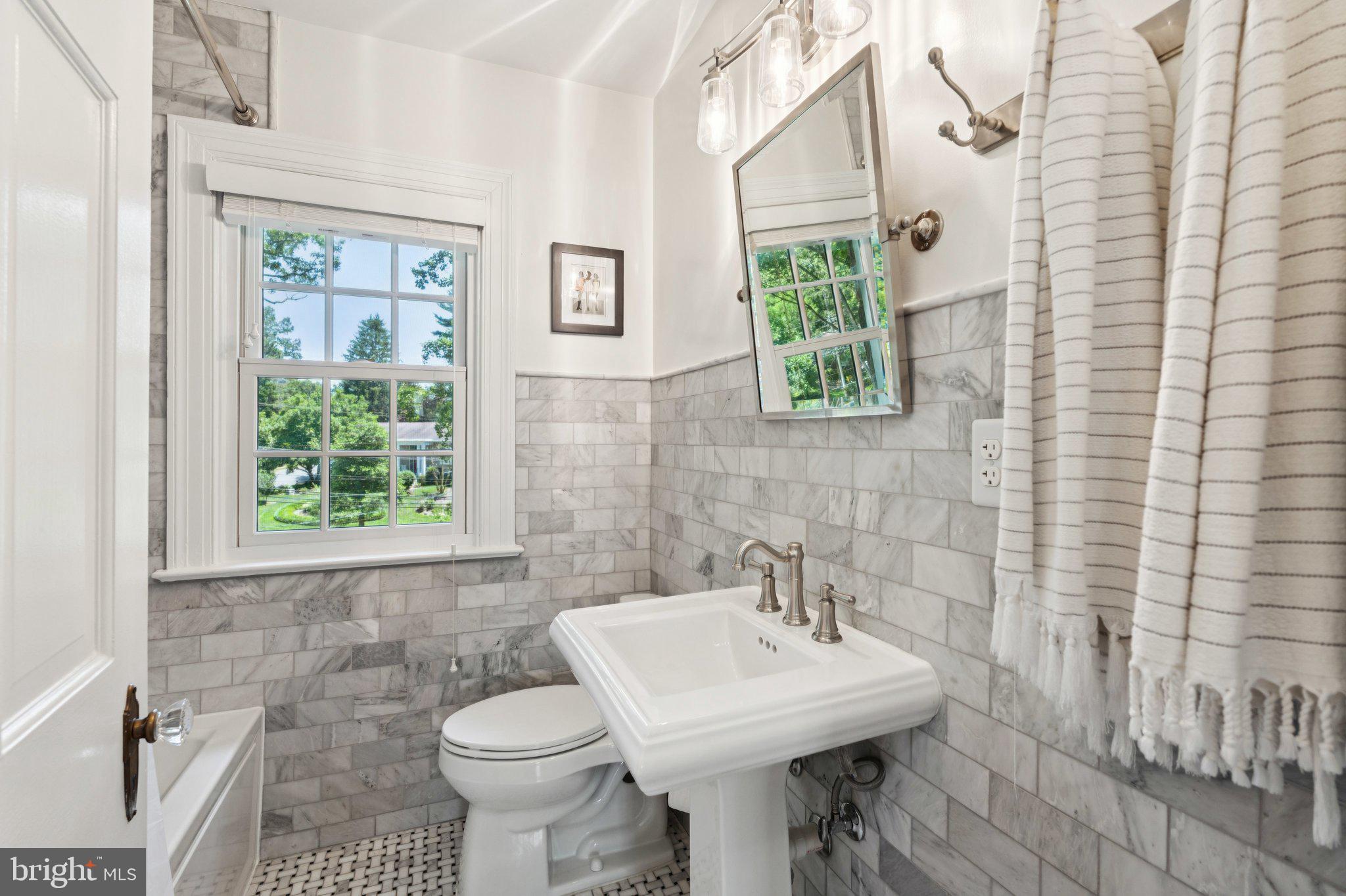 3666 Military Road Arlington, VA 22207 - Photo 25 of 69 a bathroom with a sink a toilet and a window