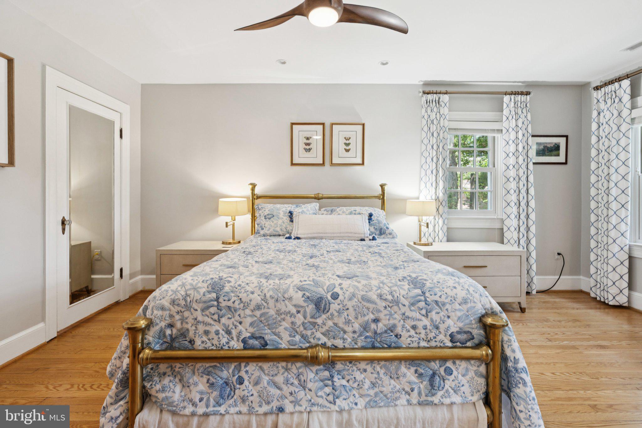 3666 Military Road Arlington, VA 22207 - Photo 28 of 69 a bedroom with a large bed and a chandelier
