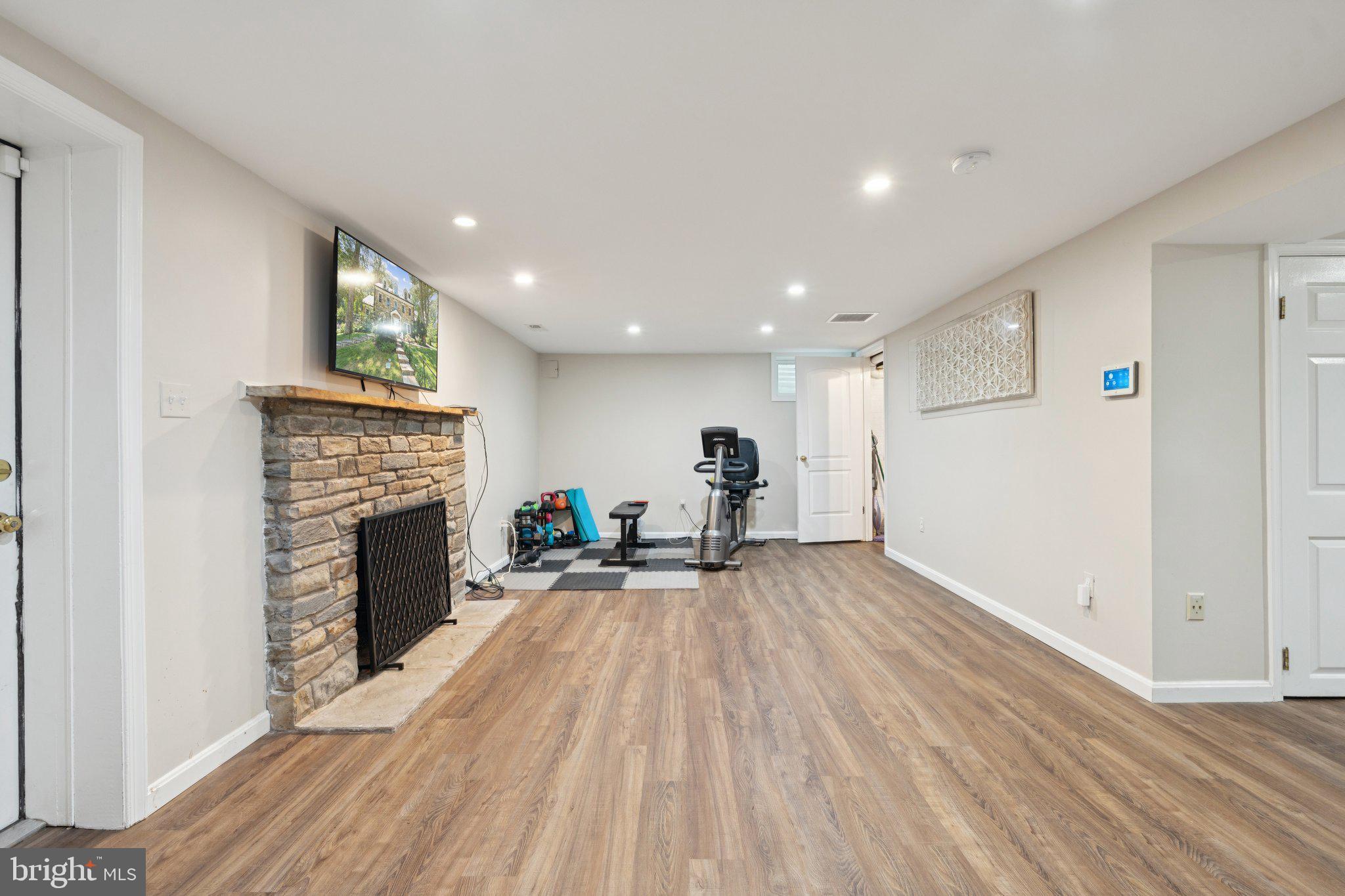 3666 Military Road Arlington, VA 22207 - Photo 38 of 69 a view of empty room with wooden floor and fireplace
