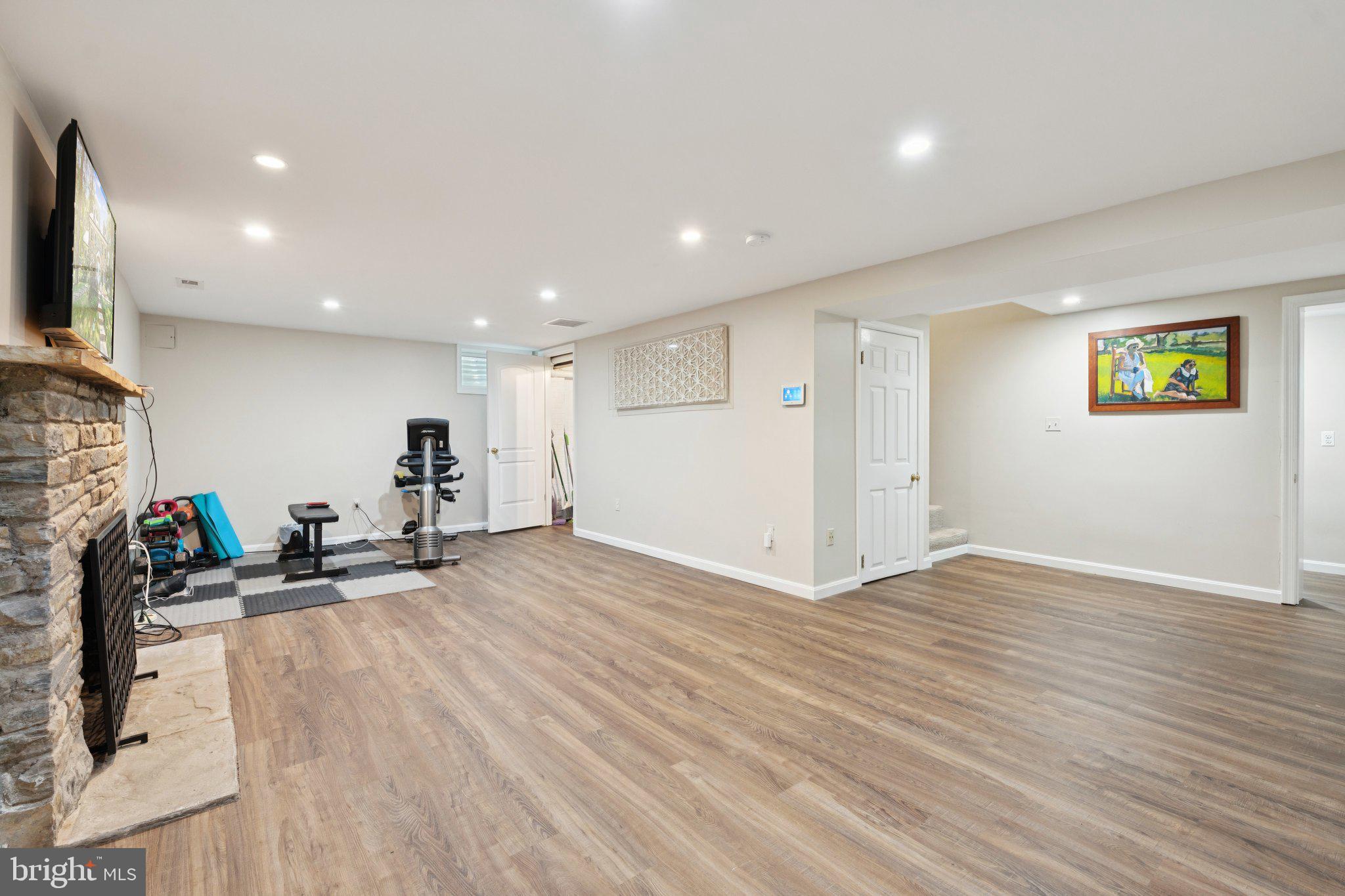 3666 Military Road Arlington, VA 22207 - Photo 39 of 69 a view of a room with gym equipment and a flat screen tv