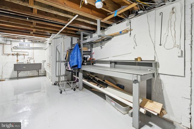 a living room with patio furniture and a large window