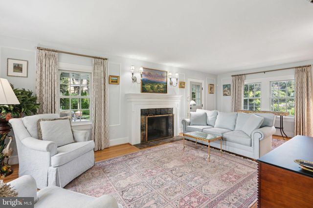 a living room with furniture window and flat screen tv