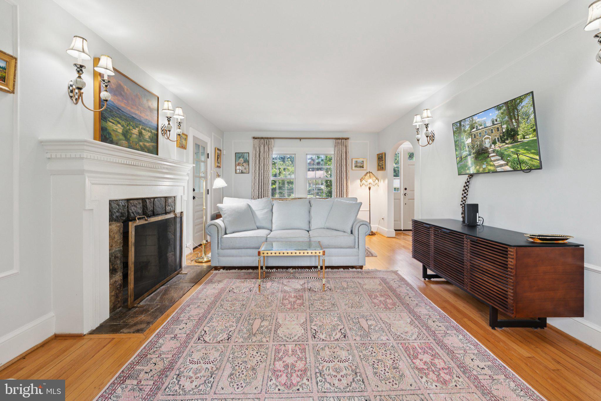 3666 Military Road Arlington, VA 22207 - Photo 10 of 69 a living room with furniture and a fireplace