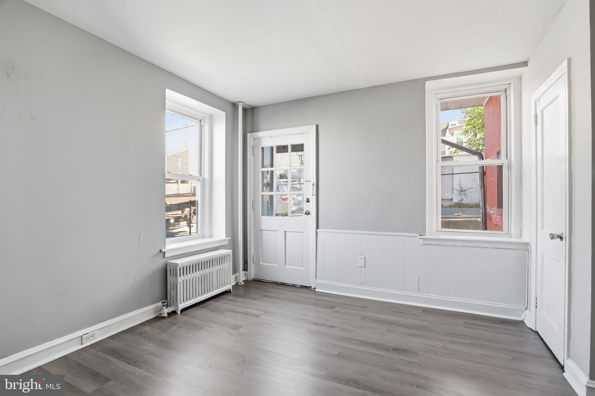 831 North 10th Street Reading, PA 19604 - Photo 12 of 33 an empty room with windows and closet