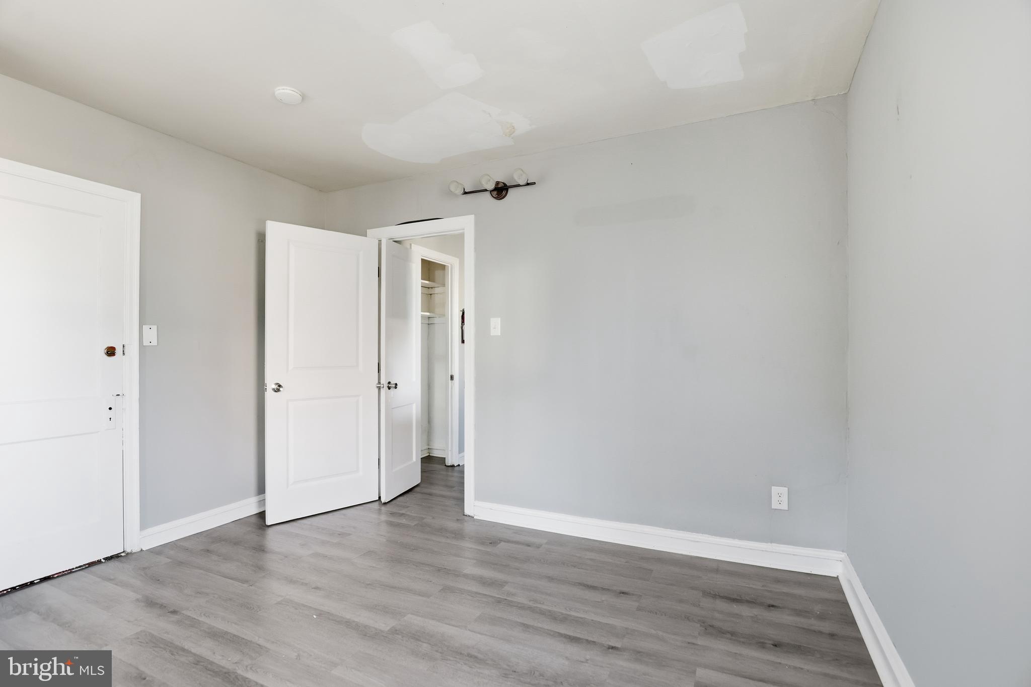 831 North 10th Street Reading, PA 19604 - Photo 15 of 33 a view of an empty room with wooden floor