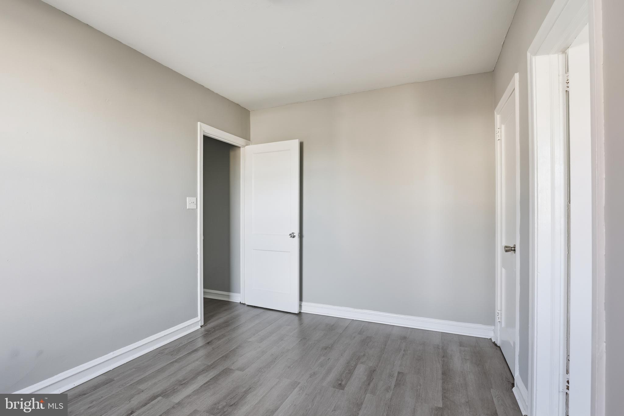 831 North 10th Street Reading, PA 19604 - Photo 17 of 33 a view of an empty room with wooden floor