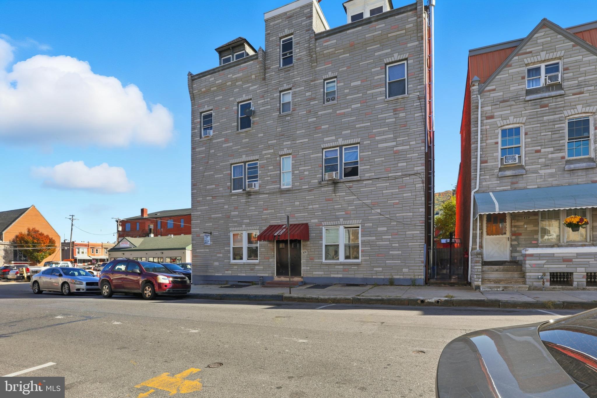 831 North 10th Street Reading, PA 19604 - Photo 2 of 33 a view of a street that has couple of cars parked on the road
