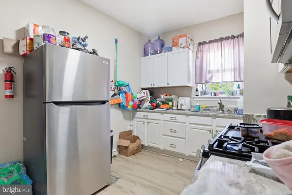 a kitchen with a refrigerator and a window