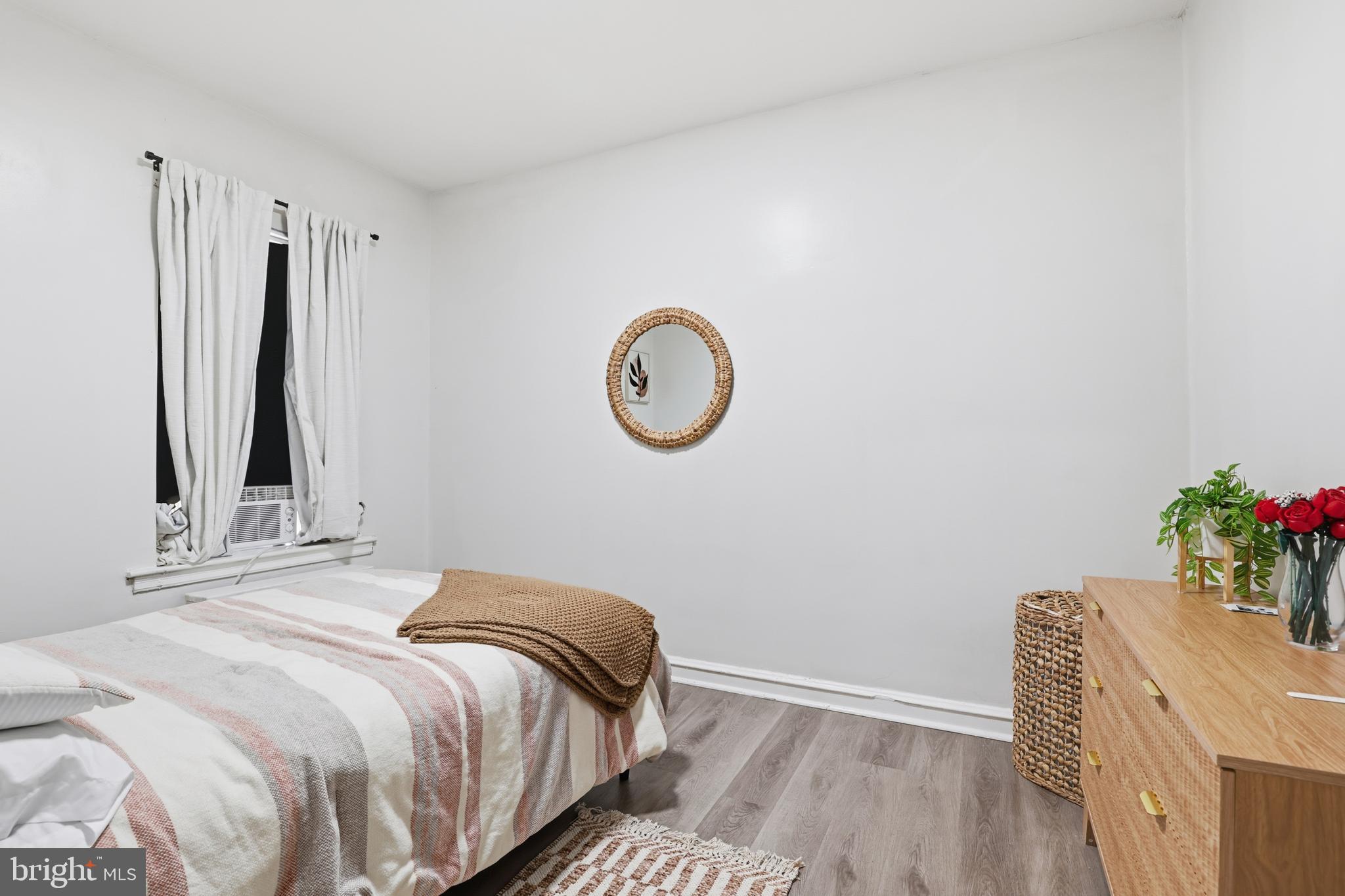 831 North 10th Street Reading, PA 19604 - Photo 28 of 33 a bedroom with a bed and a potted plant