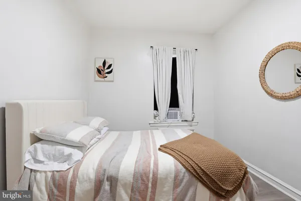 a bedroom with a bed and a chair